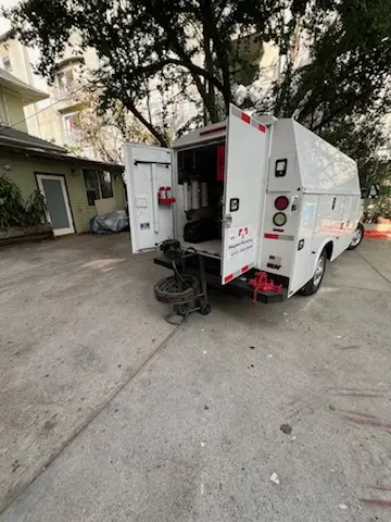 Magnet Plumbing service vehicle on-site for Grease Trap Cleaning in Florida Center